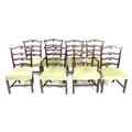 A set of eight reproduction Georgian style mahogany dining chairs, with Chippendale style ladder bac... 