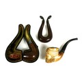 A Meerschaum pipe, the bowl modelled as a bearded gentleman wearing a turban, a further pipe with si... 