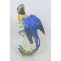 A Karl Ens porcelain figurine of a parrot, printed factory mark and impressed mark '23' to its base,... 