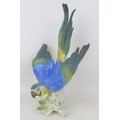 A Karl Ens porcelain parrot, with printed factory marks and impressed mark '7118' to is base, 22.5 b... 