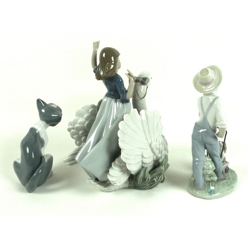 38 - A group of three Lladro figurines, comprising 'The Princess and The Swan', number 5705, 24cm high, S... 