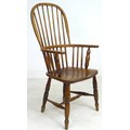 A 19th century oak Windsor chair, high rounded back with stick supports, H stretcher, turned legs, 5... 