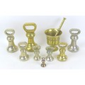 A group of eight 19th century brass bell weights, some made by Avery, 7lb and smaller, together with... 
