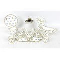 A Minton miniature cabaret tea service, decorated with floral sprays against a white ground, teapot ... 