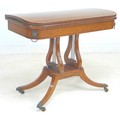A George IV mahogany, crossbanded and ebony line inlaid card table, the fold over surface inset with... 