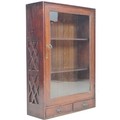 A late Victorian mahogany display case, single glazed door enclosing two fixed shelves, two small dr... 