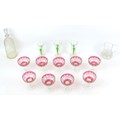 A collection of glassware, comprising nine cranberry glass champagne coups, 9.5 by 11.5cm high, thre... 