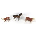 Three Beswick figurines, mid 20th century and later, comprising a Hereford bull, 949, a Hereford cow... 