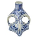 A 19th century Delft tin glazed bottle vase, with four integral handles around the central column, o... 