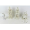 Four early 20th century Parian figurines, comprising a guitar playing musician, 15 by 13 by 32cm hig... 