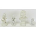 A group of four Parian ware figurines of children, including a bust of a child with round plinth, 11... 