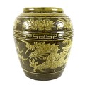 A large Chinese stoneware vase, with relief moulded decoration to the body depicting a dragon chasin... 