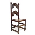 A 17th century and later oak chair, with two crescent shaped rails carved with acorns and oak leaves... 