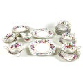An early 20th century part tea service decorated with roses and garden flowers with gilded highlight... 