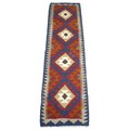 A Maimana Kelim runner, with four central lozenges, in blue, green red, orange, cream, grey and brow... 