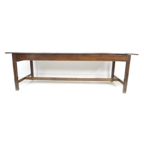 378 - A 18th century oak refectory table, the four plank surface with breadboard ends over a plain frame w... 