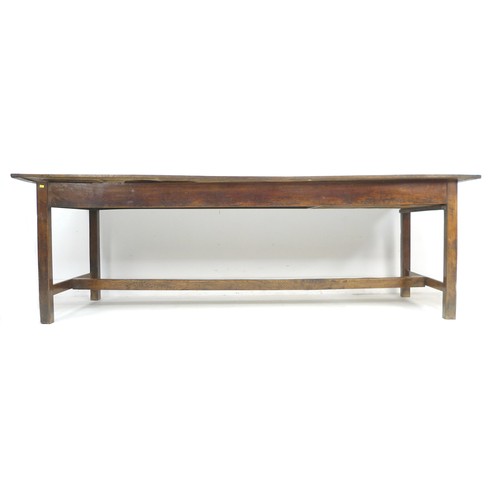 378 - A 18th century oak refectory table, the four plank surface with breadboard ends over a plain frame w... 