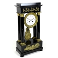 A French Empire ebonised portico clock, circa 1870, the fluted columns with brass stringing and gilt... 