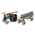 A Mamod TE1A Steam Tractor, 27 by 12.5 by 17.5cm high, with log trailer, 28 by 11 by 13cm high, toge... 