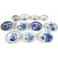 A collection of 18th century and later blue and white tea bowls and saucers, including a Worcester F... 