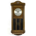 An Art Deco mahogany veneered wall clock, silvered dial signed 'Haller A.G', black Arabic numerals, ... 