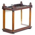 A Victorian mahogany table top display case, with carved finials, single handle to its top, three gl... 