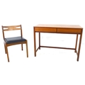 A Danish late 20th century teak desk with two drawers with rounded corners and legs, 101.5 by 48 by ... 