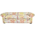 A large modern Chesterfield style sofa, four seater, with two loose feather cushions, upholstered in... 