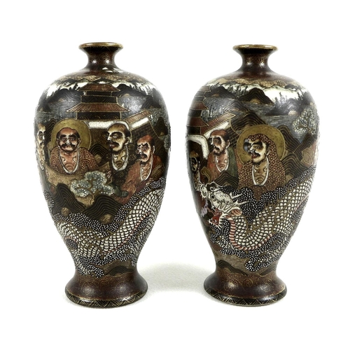 2 - A pair of Japanese Satsuma pottery vases, Meiji period, of ovoid form with flared foot, the ivory co... 