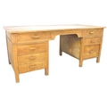 A Victorian pine pedestal desk, in three sections, with two shallow drawers to the top, above one pe... 