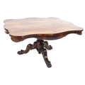 A Victorian rosewood breakfast table, fixed top of serpentine outline, moulded decoration, raised on... 