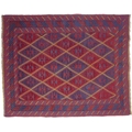 A Gazak rug with diamond pattern to field in red, dark blue, light blue and yellow, multiple borders... 