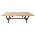 An unusual chestnut and oak dining table, circa 1940s, with rectangular three plank surface, raised ... 