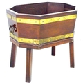 An early 19th century mahogany wine cooler, of octagonal form, with brass double banding and handles... 