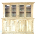 A Victorian pitch pine dresser double cupboard unit, with four glazed doors above opening to reveal ... 