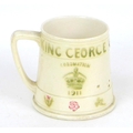 A Moorcroft commemorative King George V and Queen Mary Coronation mug, with impressed mark and 'From... 