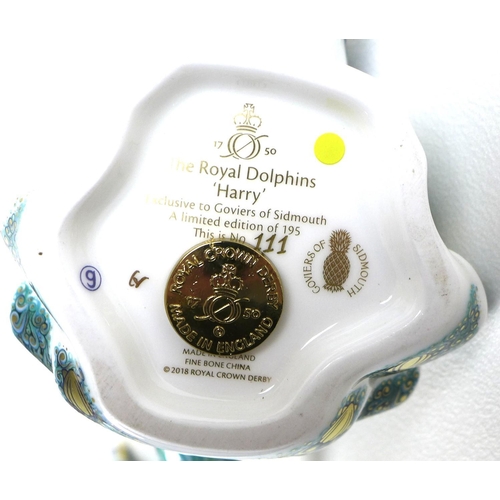 32 - A pair of Royal Crown Derby commemorative paperweights, modelled as 'The Royal Dolphins', 'Harry' an... 