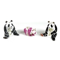 A group of three Royal Crown Derby paperweights comprising 'Pink Baby Panda - Walking', limited edit... 