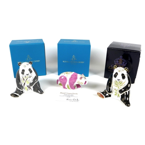 33 - A group of three Royal Crown Derby paperweights comprising 'Pink Baby Panda - Walking', limited edit... 