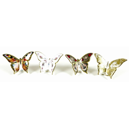 45 - A group of four Royal Crown Derby paperweights, all modelled as butterflies, comprising 'Peacock But... 