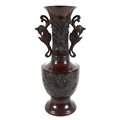 A modern Chinese bronzed vase, of baluster form with long flared neck having pierced and scrolled ha... 