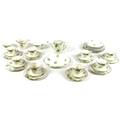 An Art Deco Wedgwood & Co Ltd pottery part tea service, decorated with green leaves, gilt and black ... 