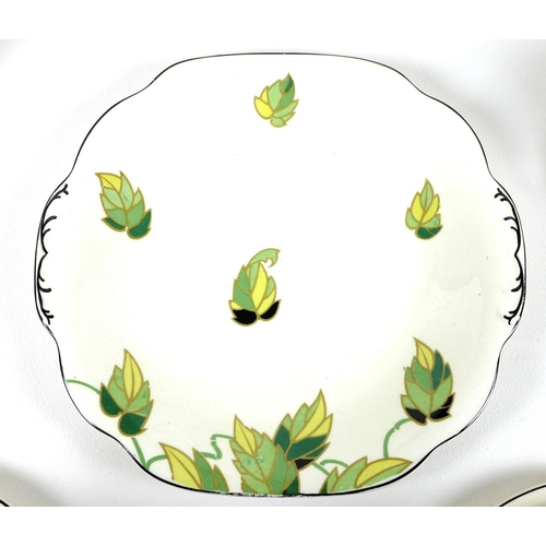 57 - An Art Deco Wedgwood & Co Ltd pottery part tea service, decorated with green leaves, gilt and black ... 