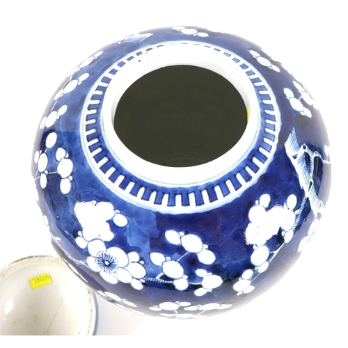 7 - A Chinese blue and white ginger jar and cover the cobalt blue ground decorated with cherry blossoms ... 