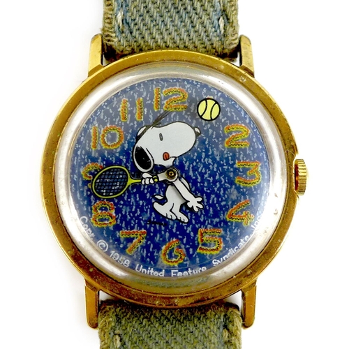 110 - A vintage Timex 'Snoopy Tennis' mystery dial wristwatch, circa 1960s, circular blue 'denim' dial wit... 