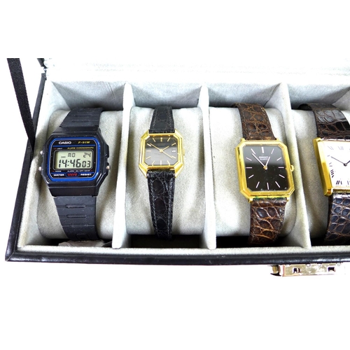 112 - A group of five vintage Seiko gold plated gentleman's quartz wristwatches, four with black dials and... 