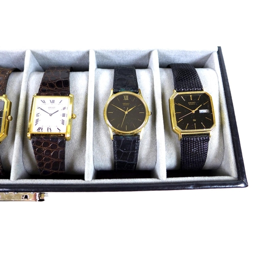 112 - A group of five vintage Seiko gold plated gentleman's quartz wristwatches, four with black dials and... 