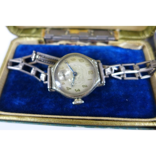 117 - A group of three Edwardian lady's wristwatches, comprising a J. W. Benson 9ct gold cased wristwatch,... 