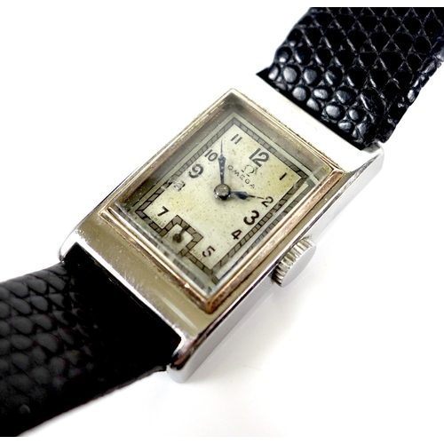 132 - An Art Deco Omega stainless steel cased lady’s tank wristwatch, with square silvered dial, black Ara... 