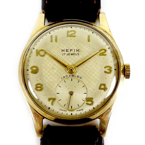 143 - A Hefix 9ct gold cased gentleman's wristwatch, circa 1950s, circular silvered dial, raised gold Arab... 